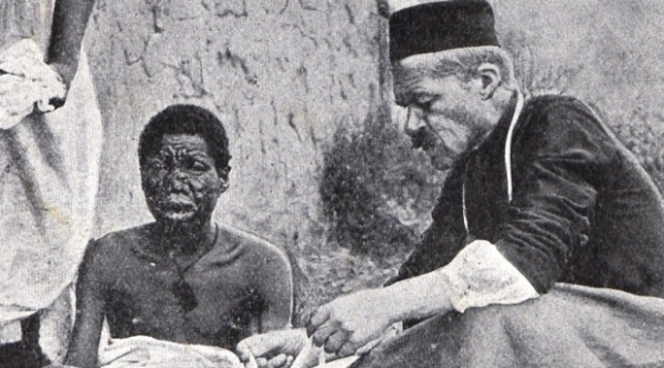  O. Beyzym opatruje rany trędowatym.  